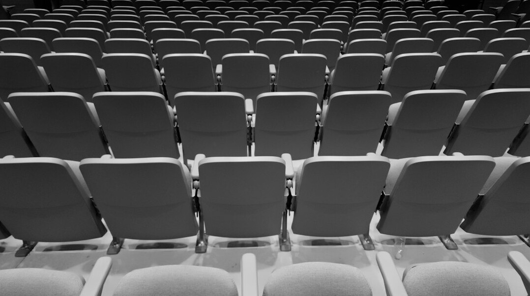 Cinema screening room with seats facing a screen