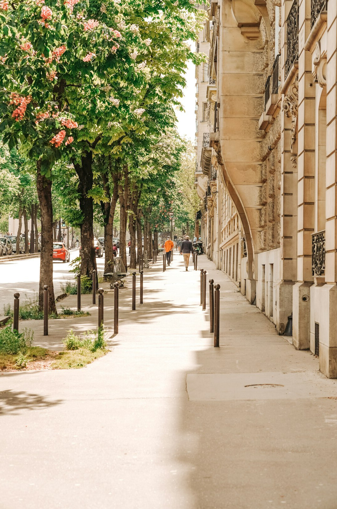 European city street with buildings and pedestrians in the distance
