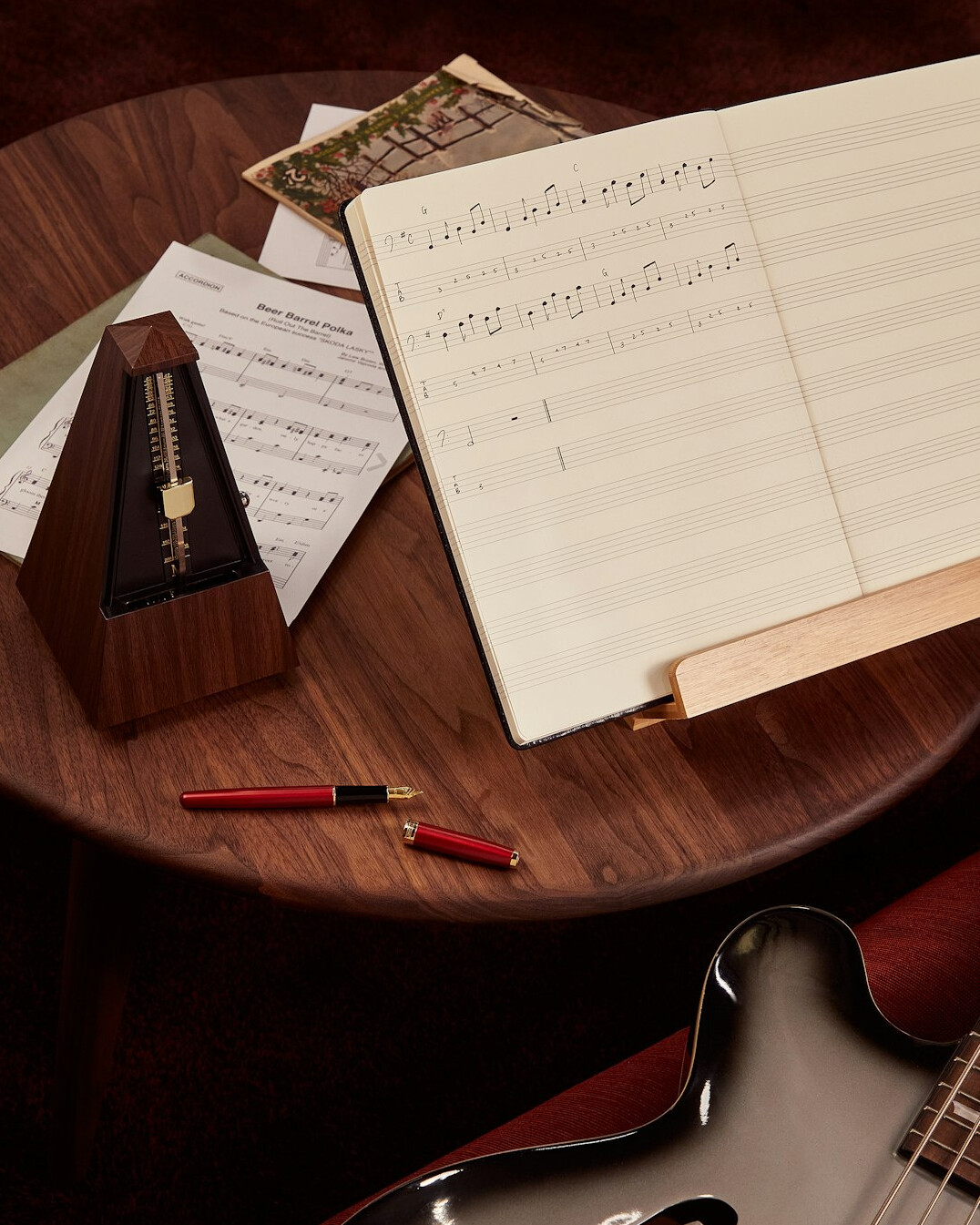 Notes and questionnaire sheets on a desk with a pen