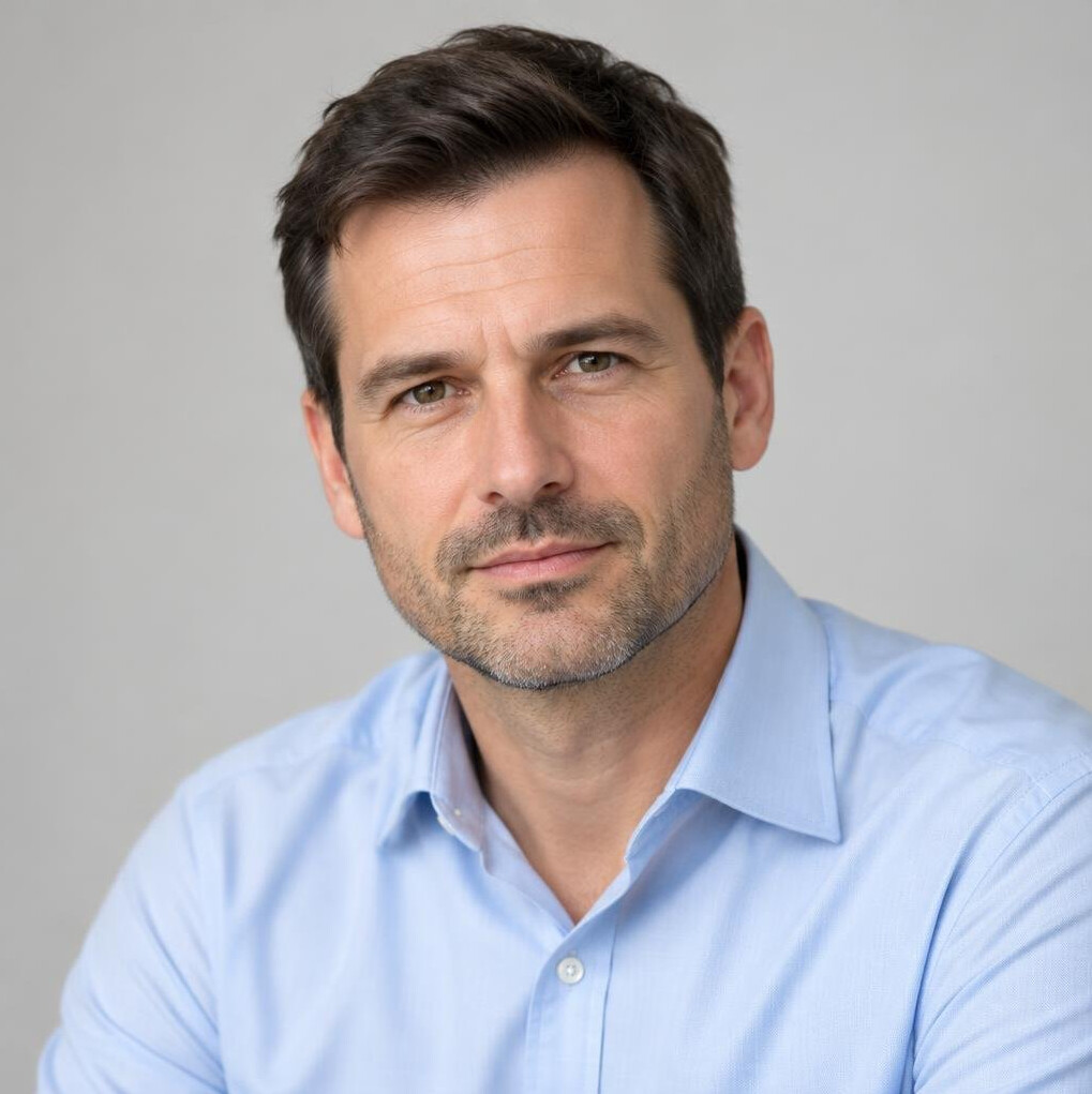 Portrait of a man in a shirt looking at camera