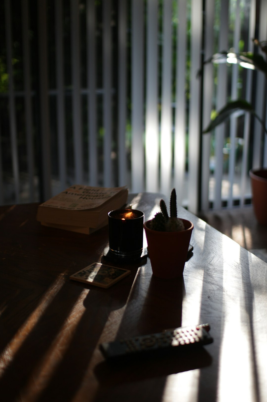 Desk with notebook, pen and papers in warm light